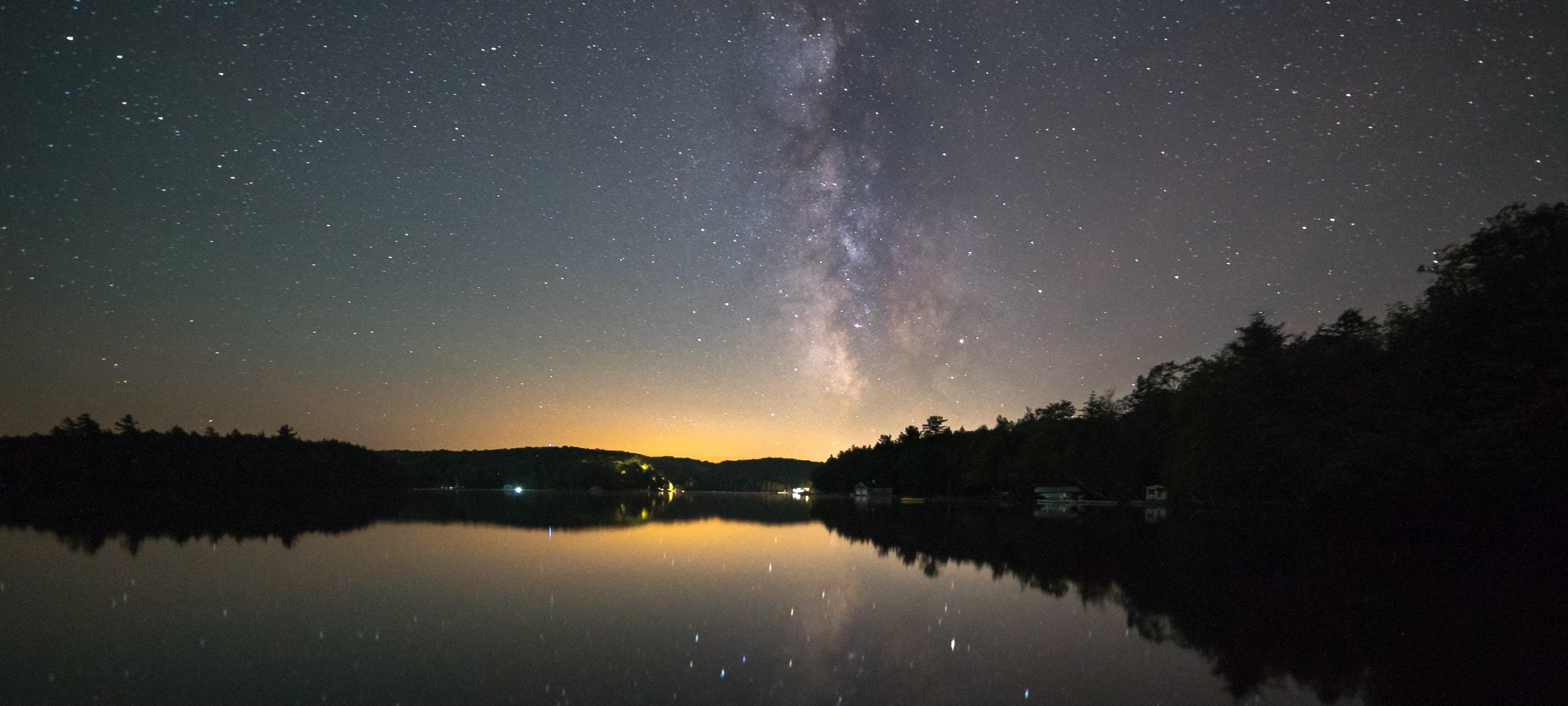 Stars and lake at dusk in Baysville, ON